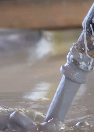 Hose Pouring Fresh Concrete